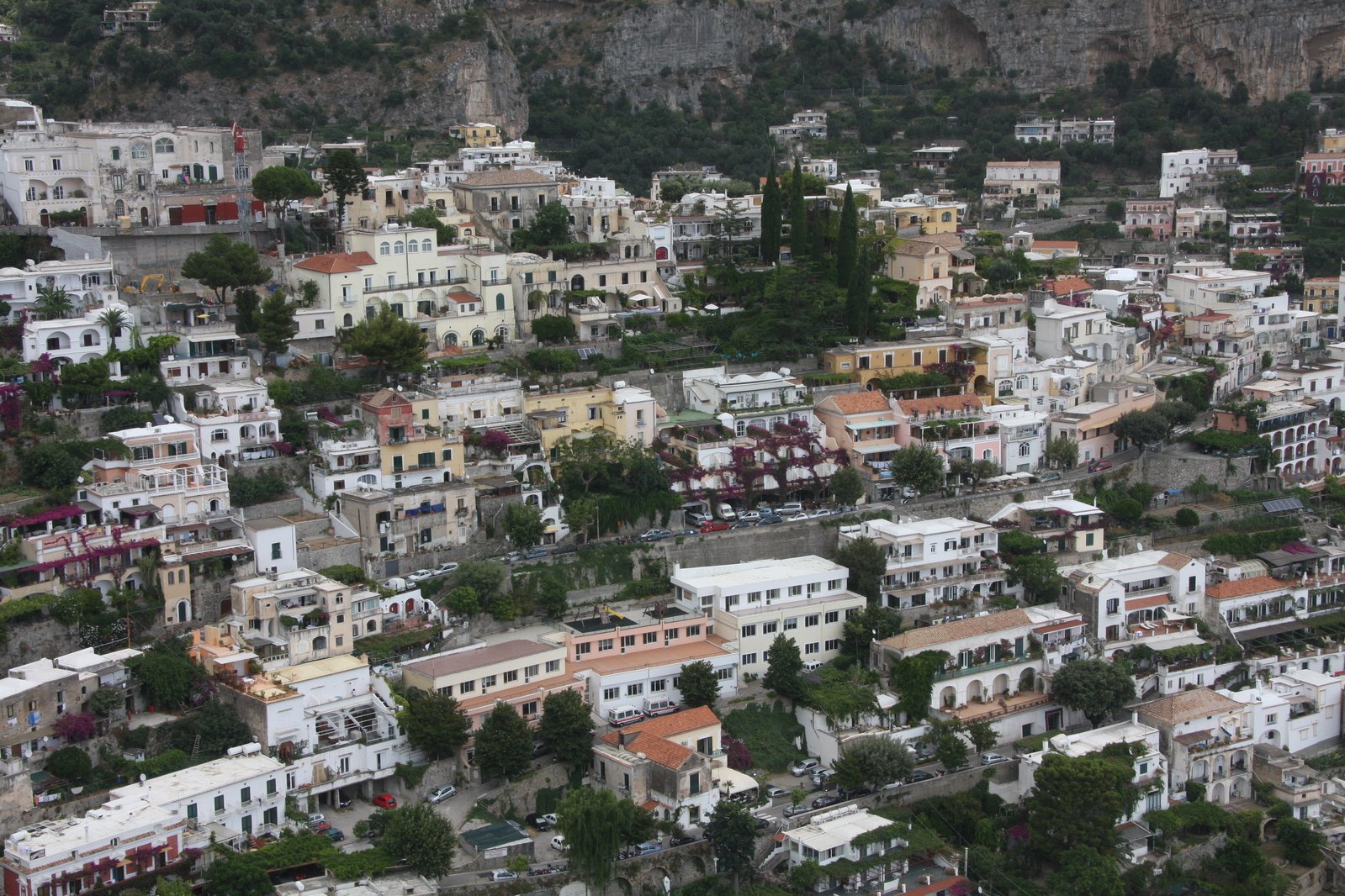 a view of a city, with many houses on the hillside