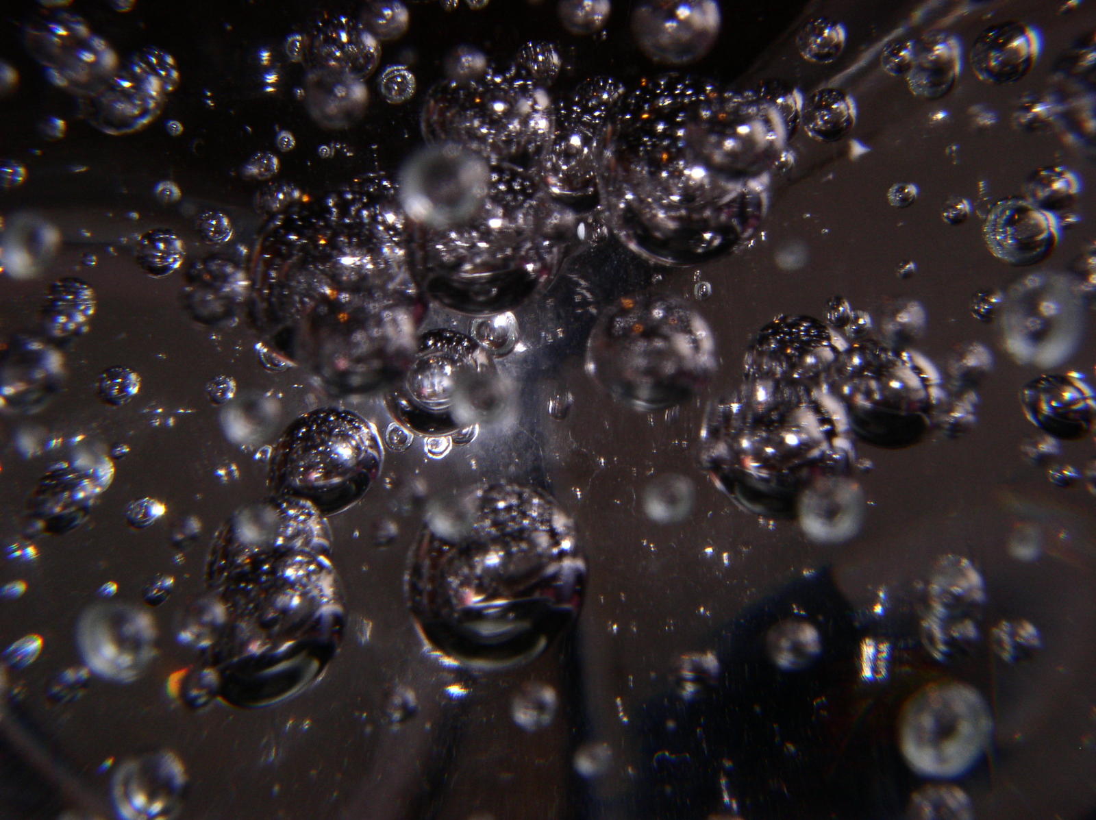 bubbles are arranged in front of a black background
