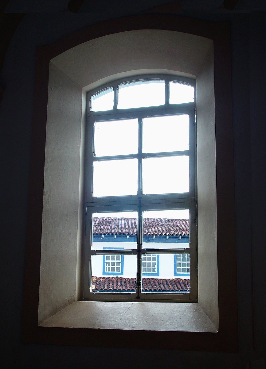 a window with a bright light shining in