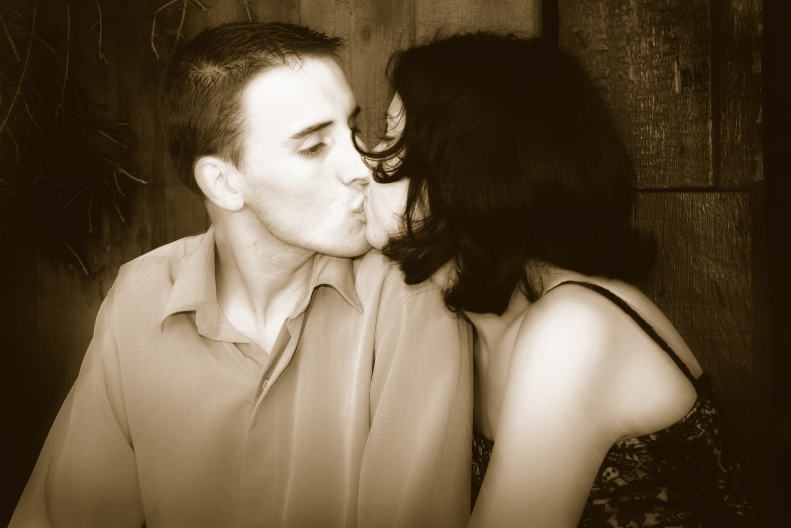 an image of a man kissing a woman