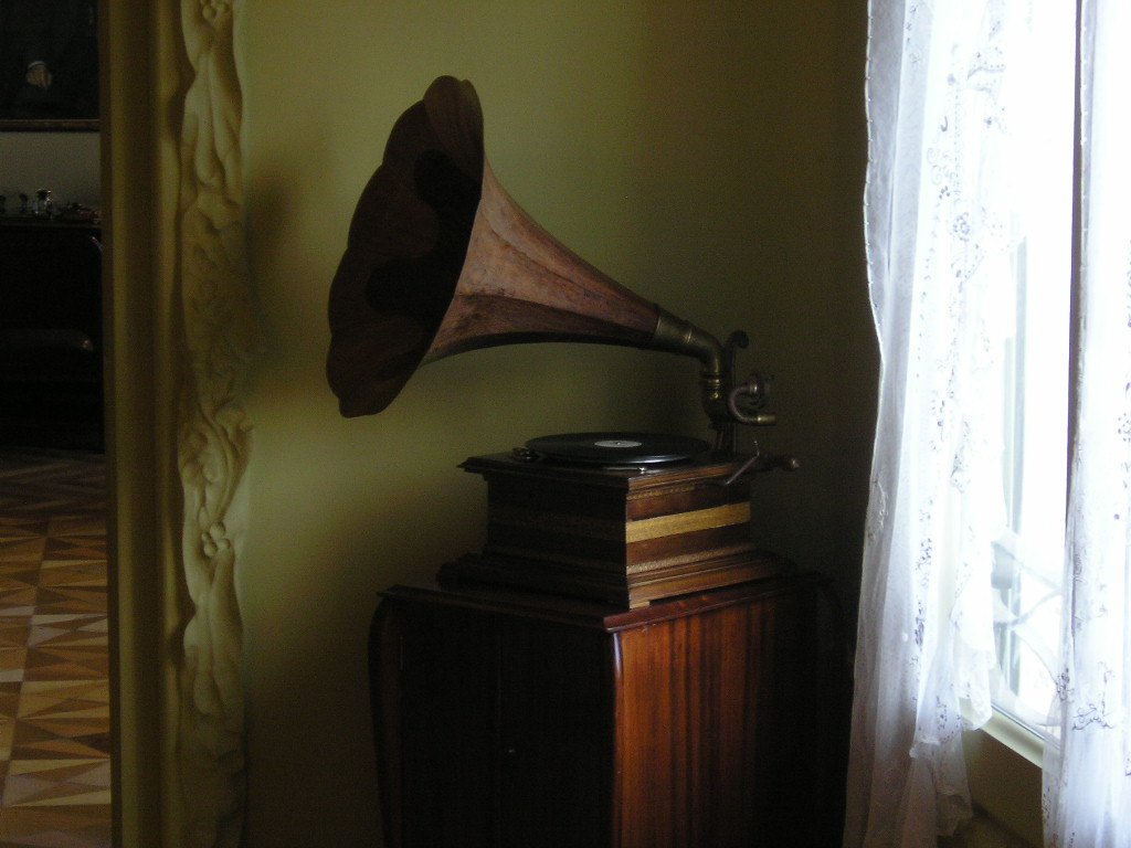a large wooden trumpet and an old record player
