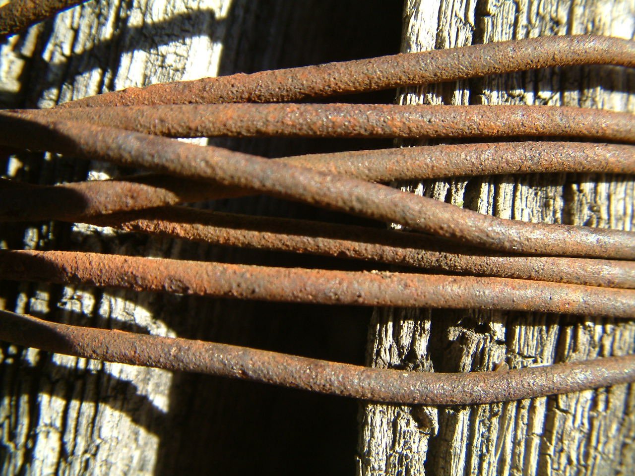 an old iron fence with rusted nails is shown