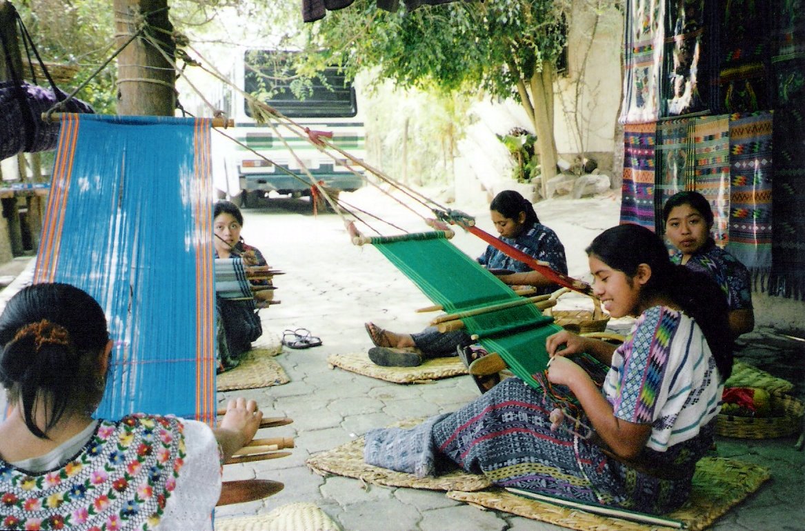 the people are weaving together on the tarp