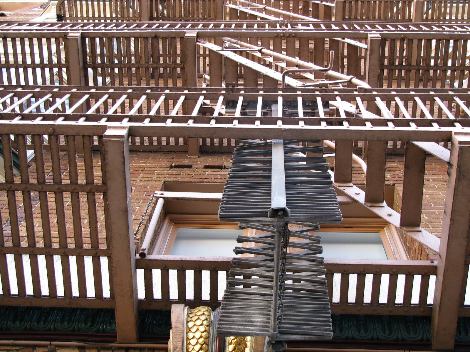 an aerial view of two rows of wooden benches