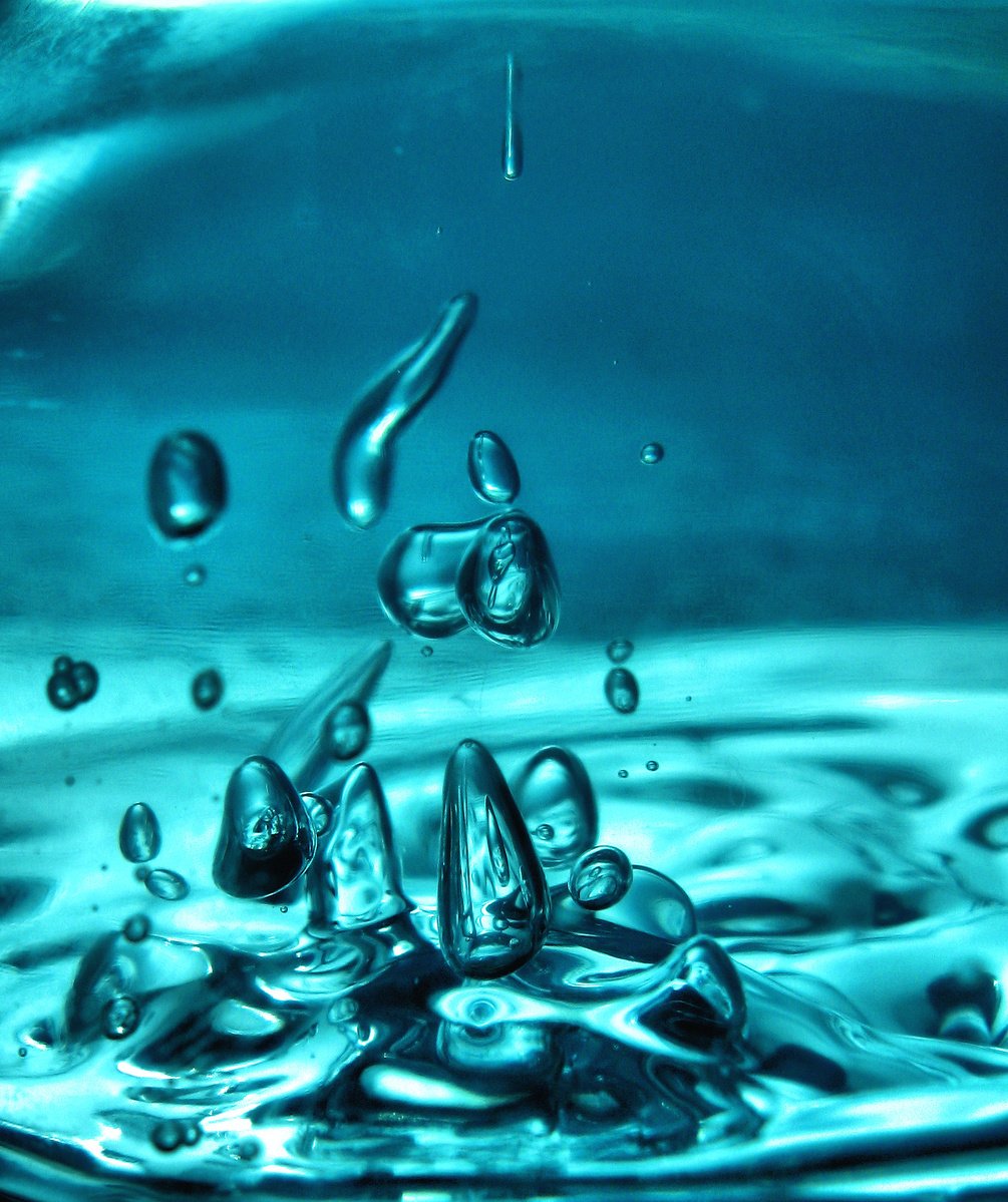 a water droplet with several circles and drops on it