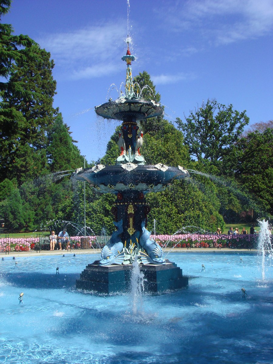 a fountain with lots of water and statues