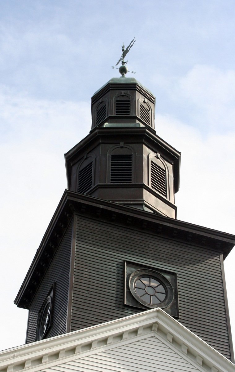 this large building has a very tall clock tower