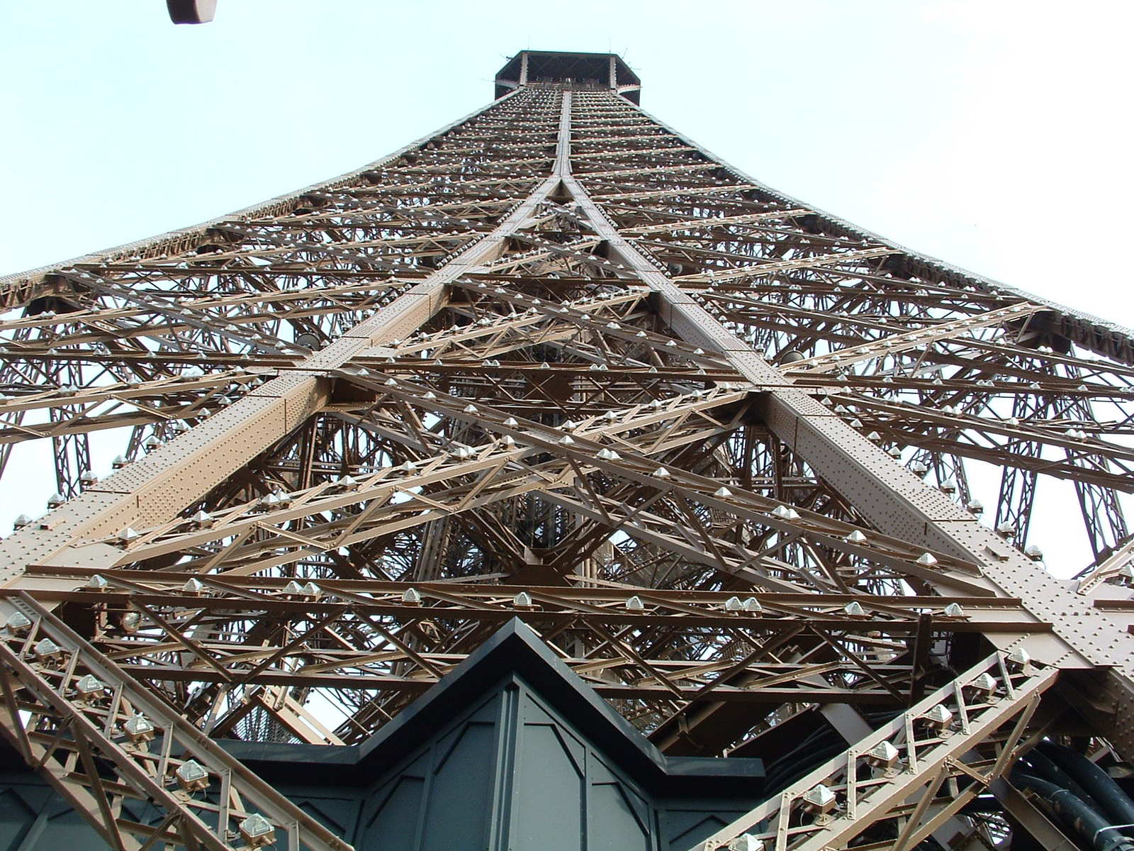 a tall metal structure that looks like it has a sky background