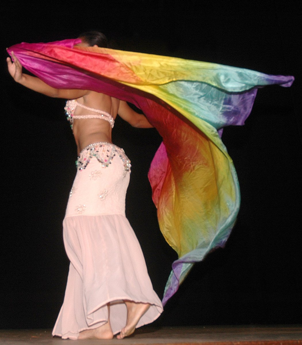 a woman wearing an extremely colorful scarf on her head