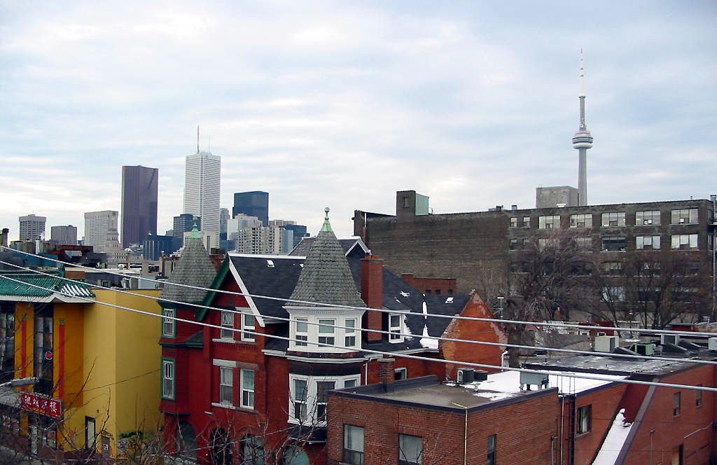 a cityscape in the distance with apartment buildings