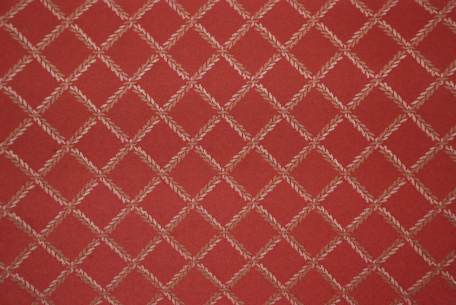red cloth with white stitches, ornament background