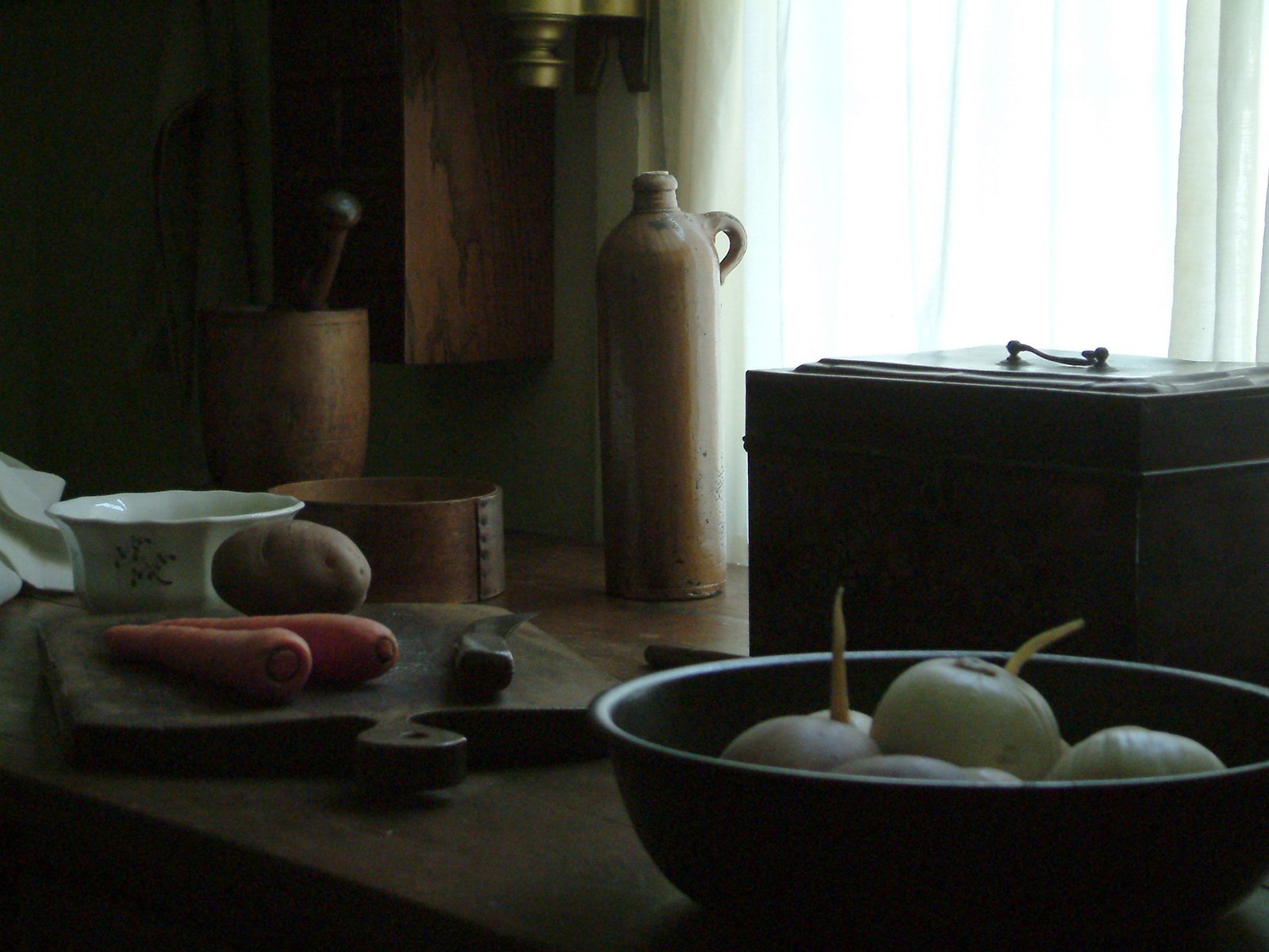 a black bowl some white onions and spices