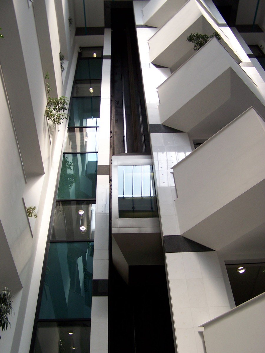 a view down into a building from the top floor