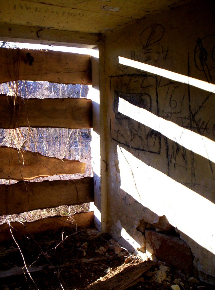 a wooden fence is shown with graffiti on it