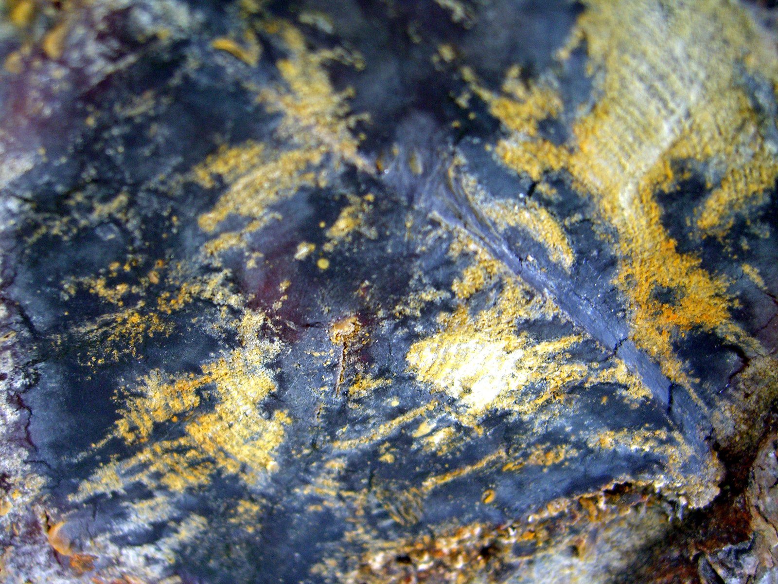 some sort of dirty surface with yellow and blue colors