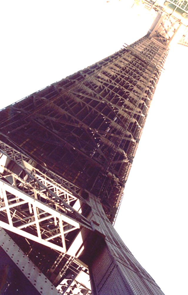 a tall tower with an ornate spire beneath it