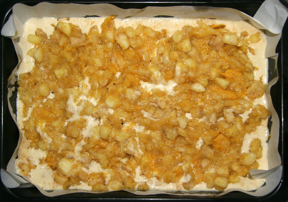 a pan with an uncooked casserole topped in various toppings