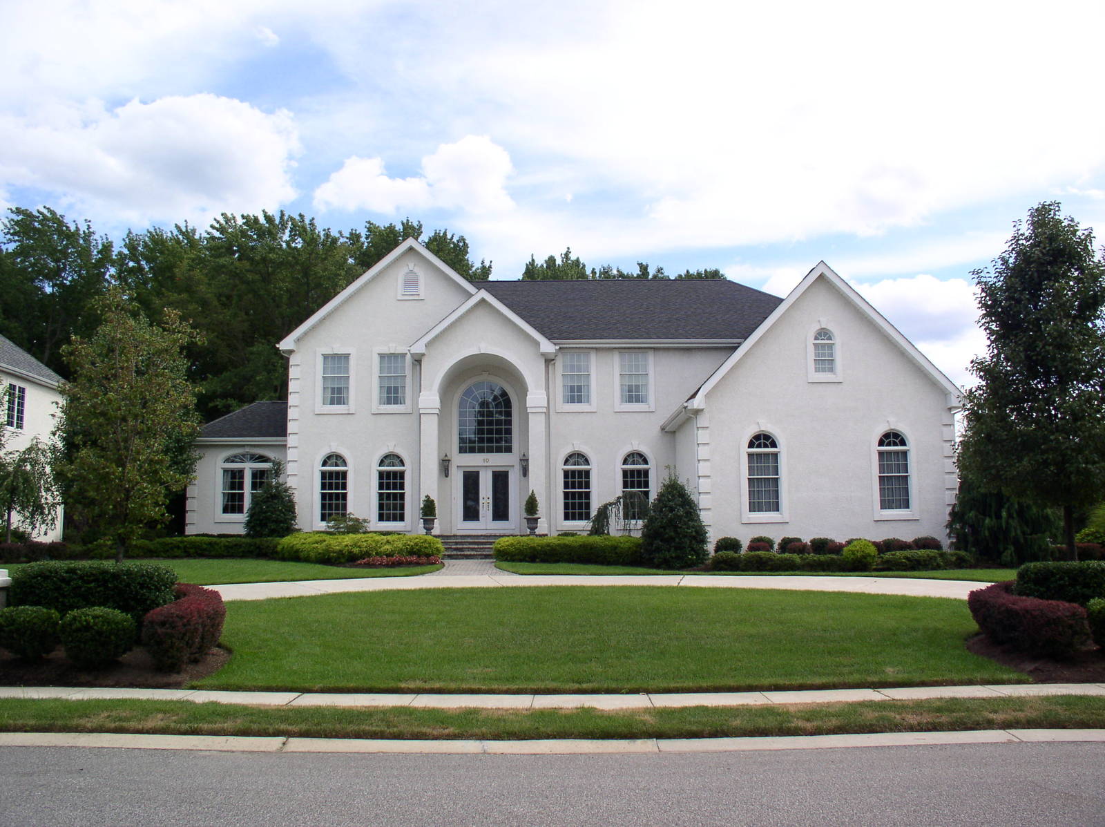 a home with two large white lawn frontages