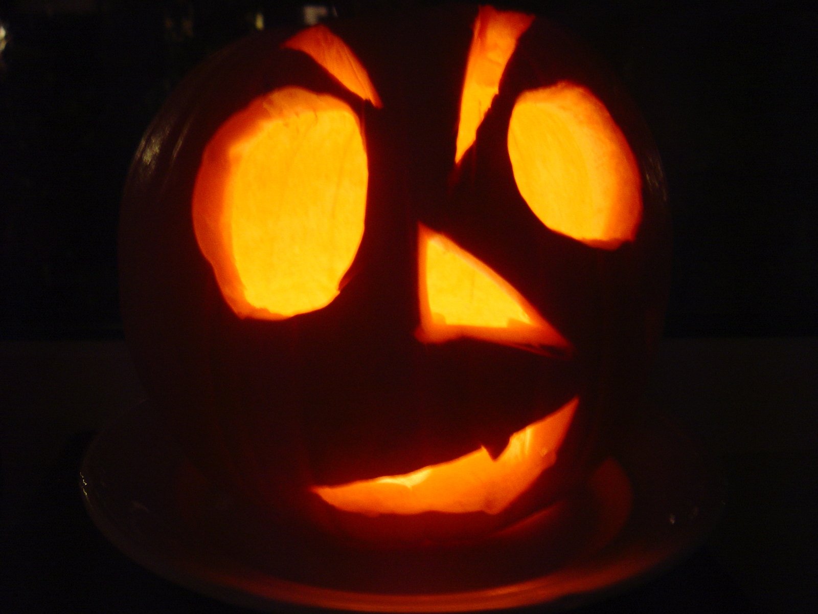 an image of a carved pumpkin with scissors