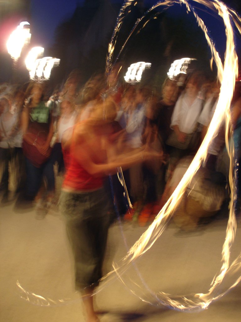 a blurred image of some fire torches