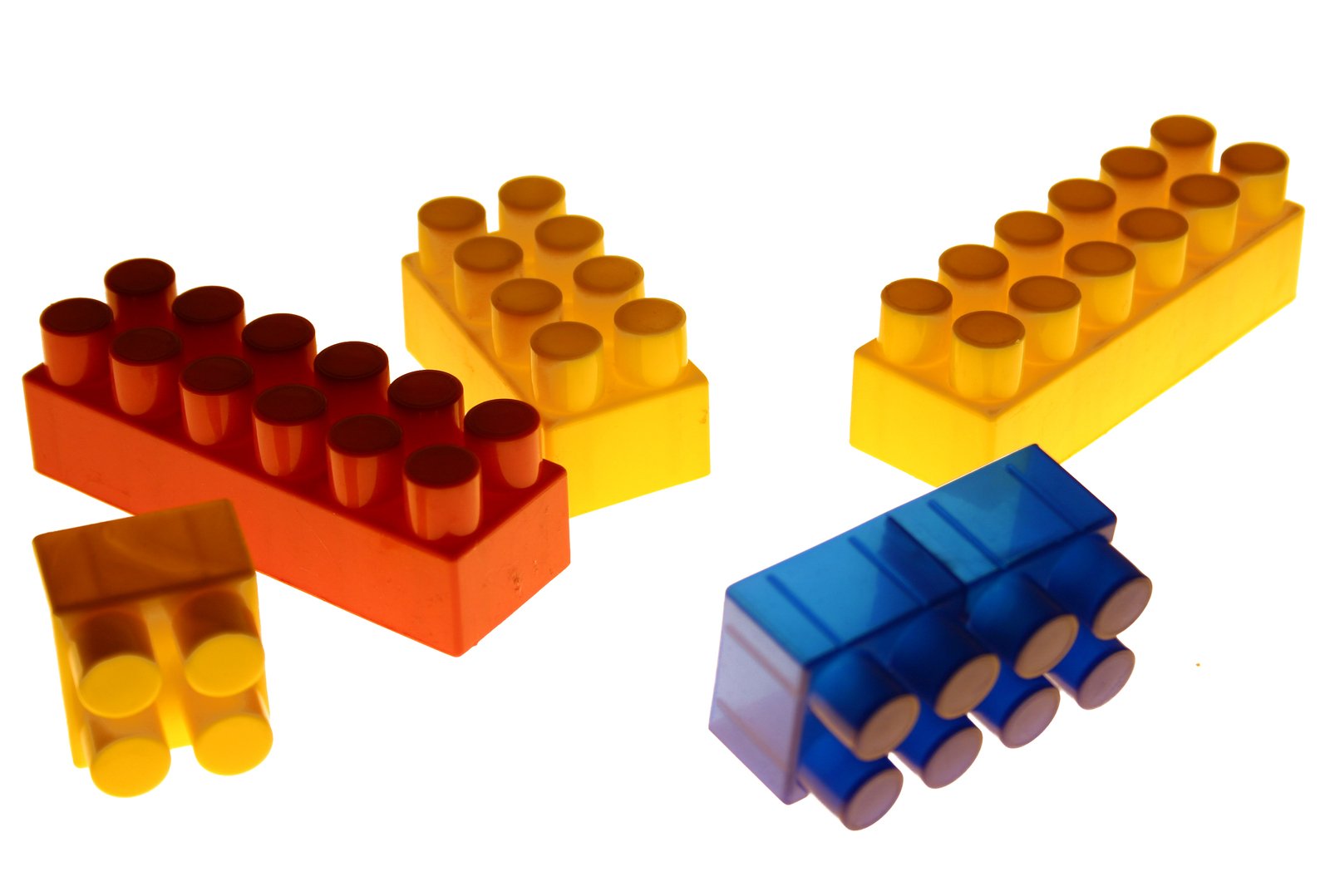 four lego blocks with one laying and the other laying down