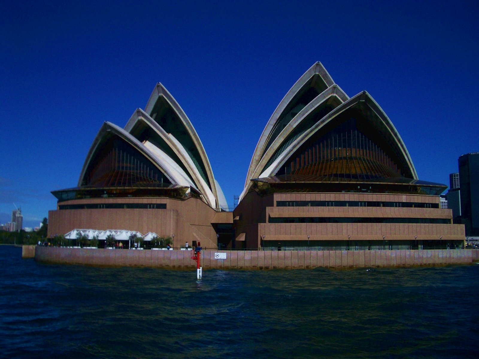 the sydney opera house on the water is shown