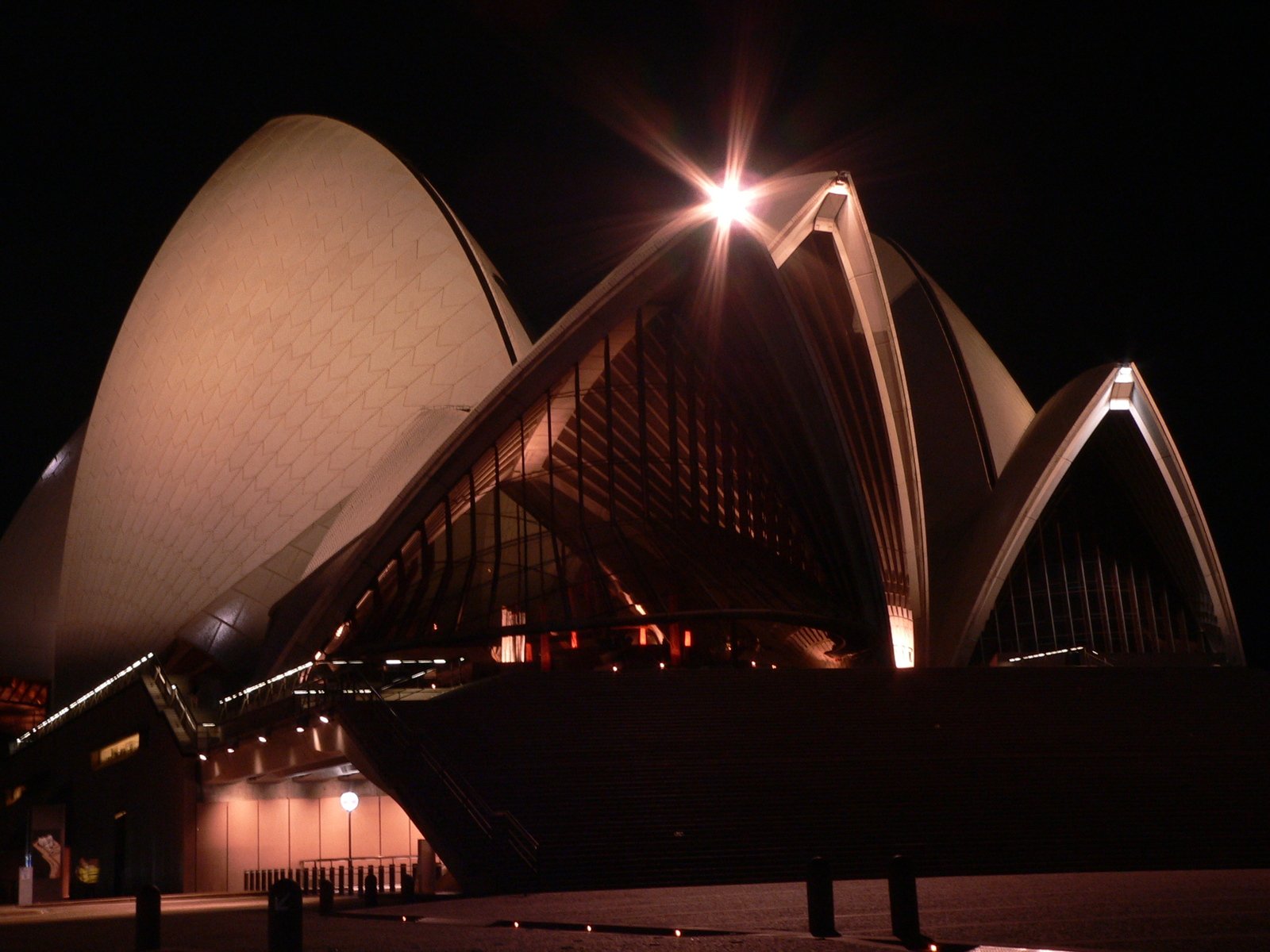 the top of the building is lit up at night