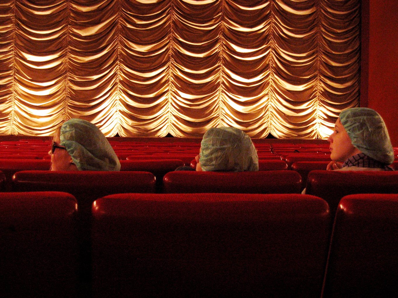 an empty theater with a curtained area in the background