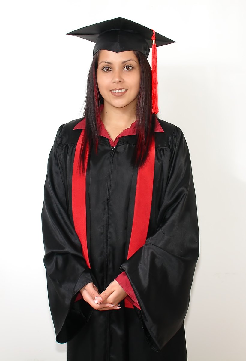 a woman in a graduation gown is smiling