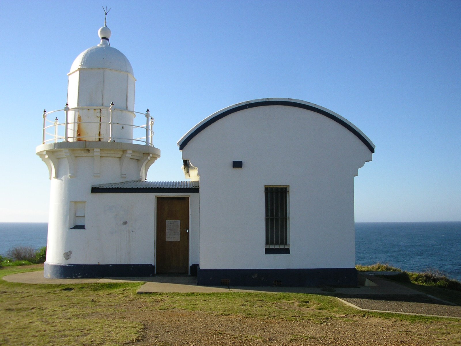 this is a lighthouse on a hill overlooking the water