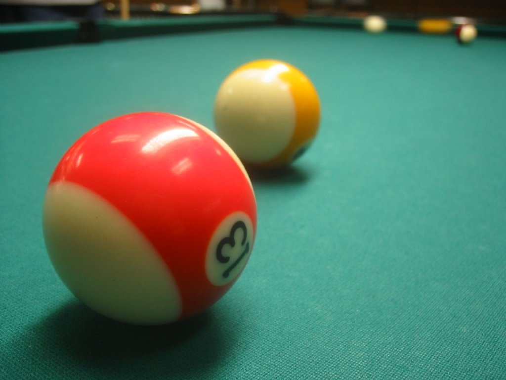 two billiards and one is a yellow ball