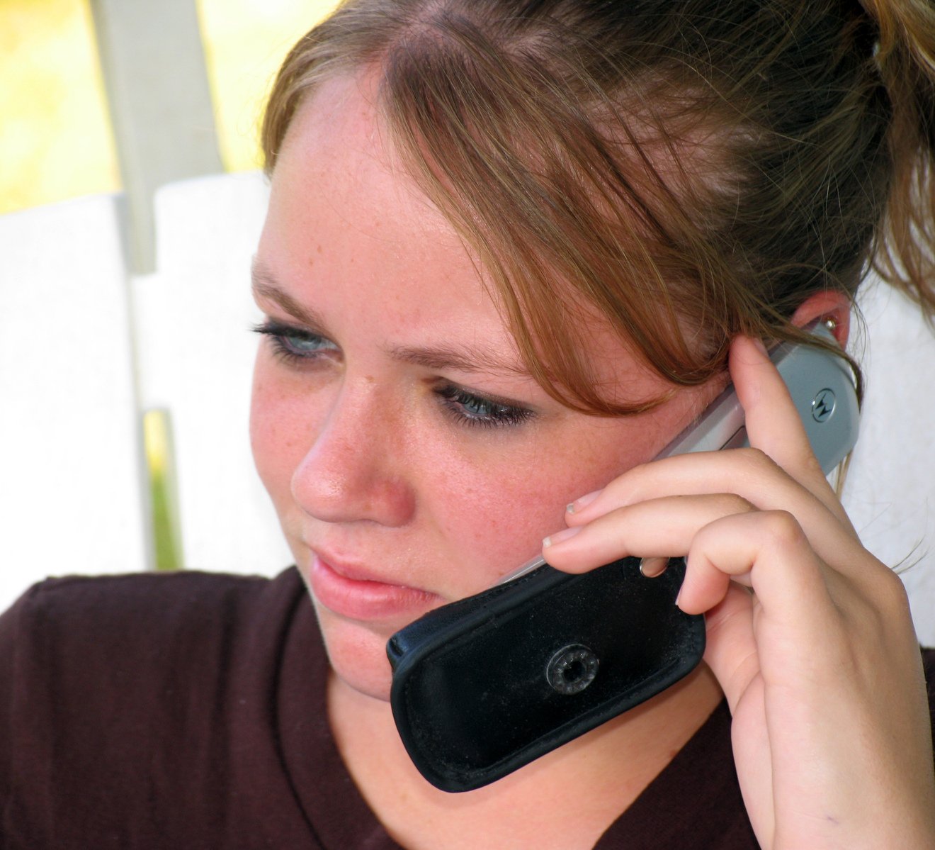 a woman with a cell phone to her ear