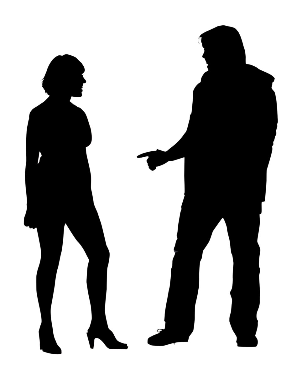 an image of a couple silhouetted with each other