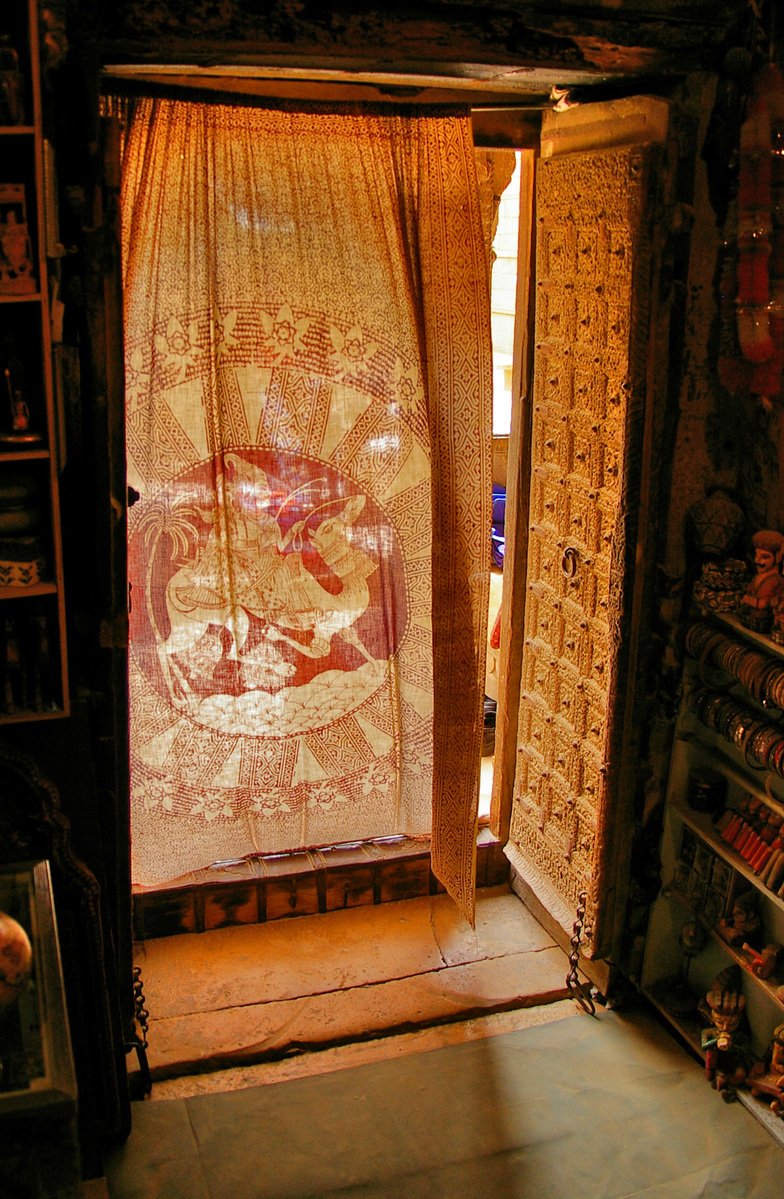 there is a very ornate curtain in the window