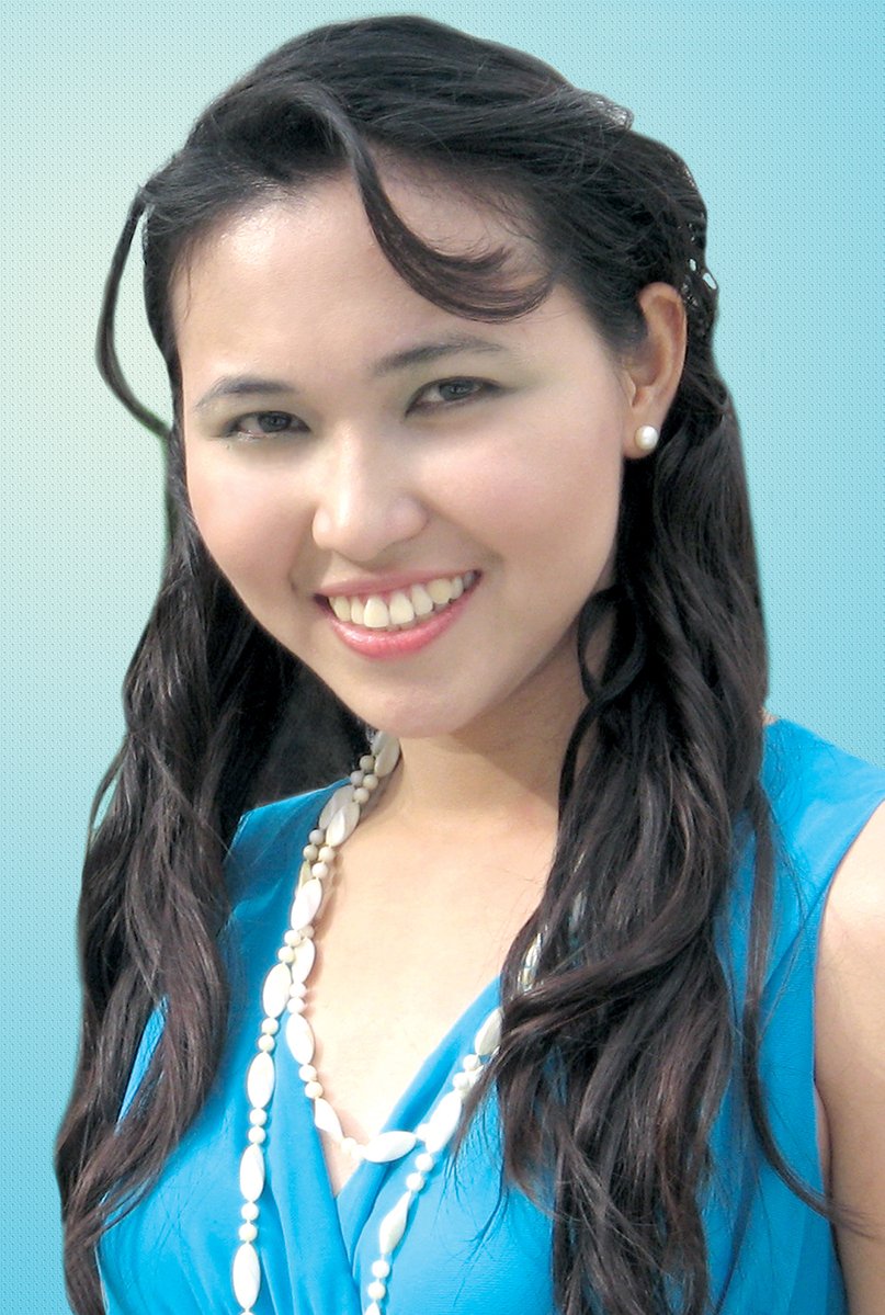 young asian woman with blue dress and beads