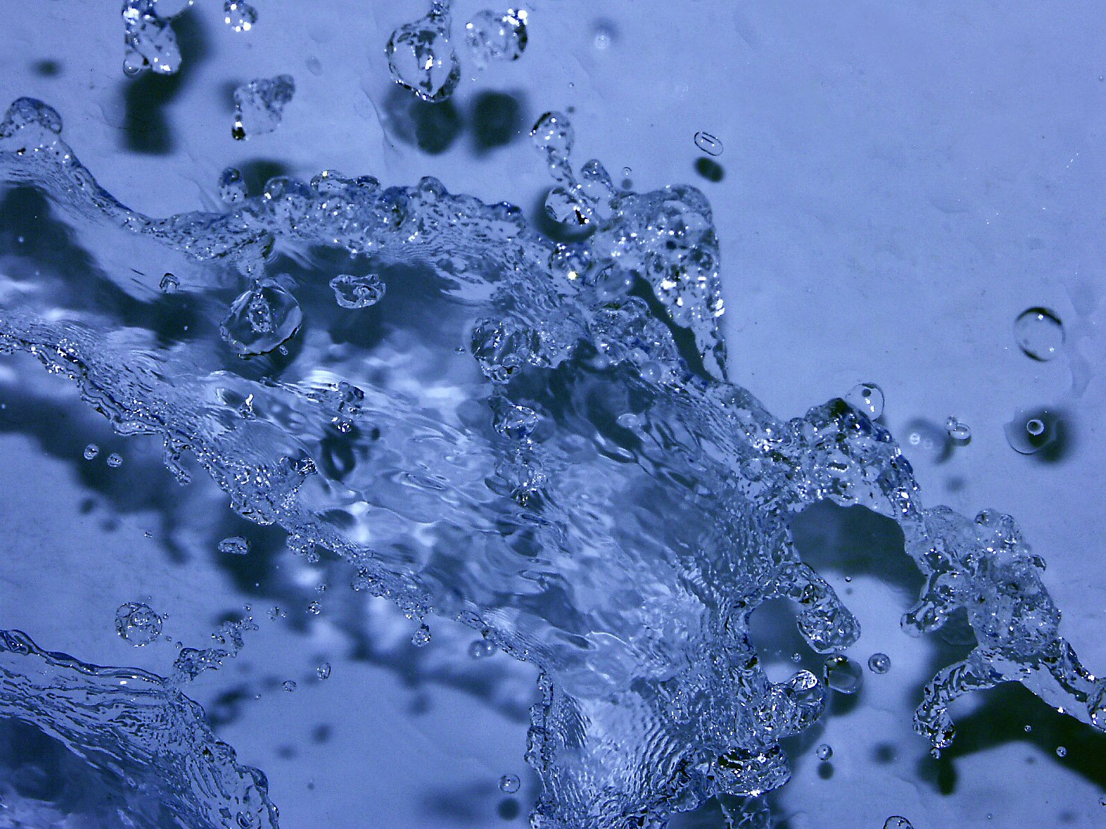 close up view of water splashing in the sink