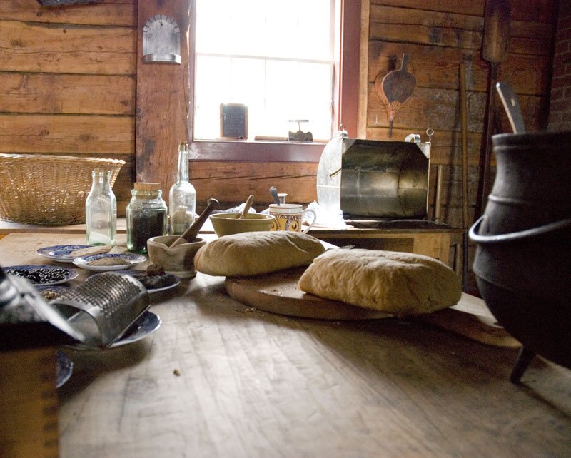 some items sit on a table in front of a window