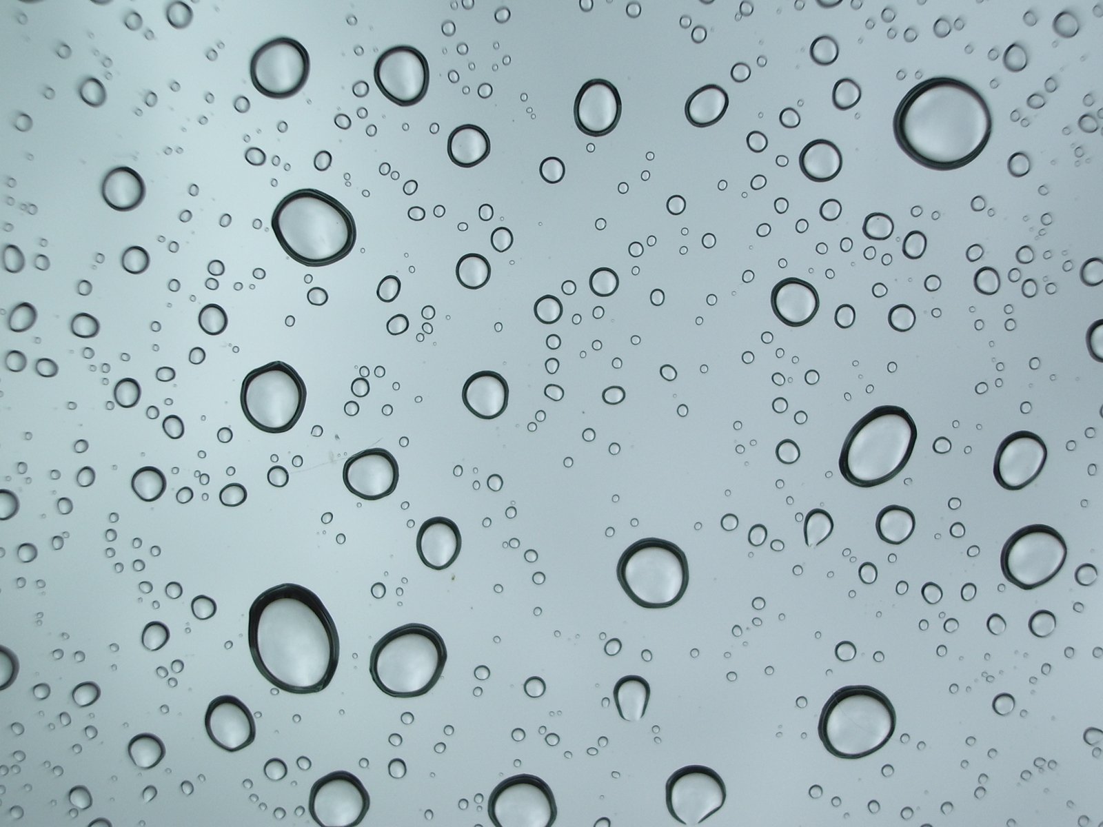 droplets of water floating down on the surface