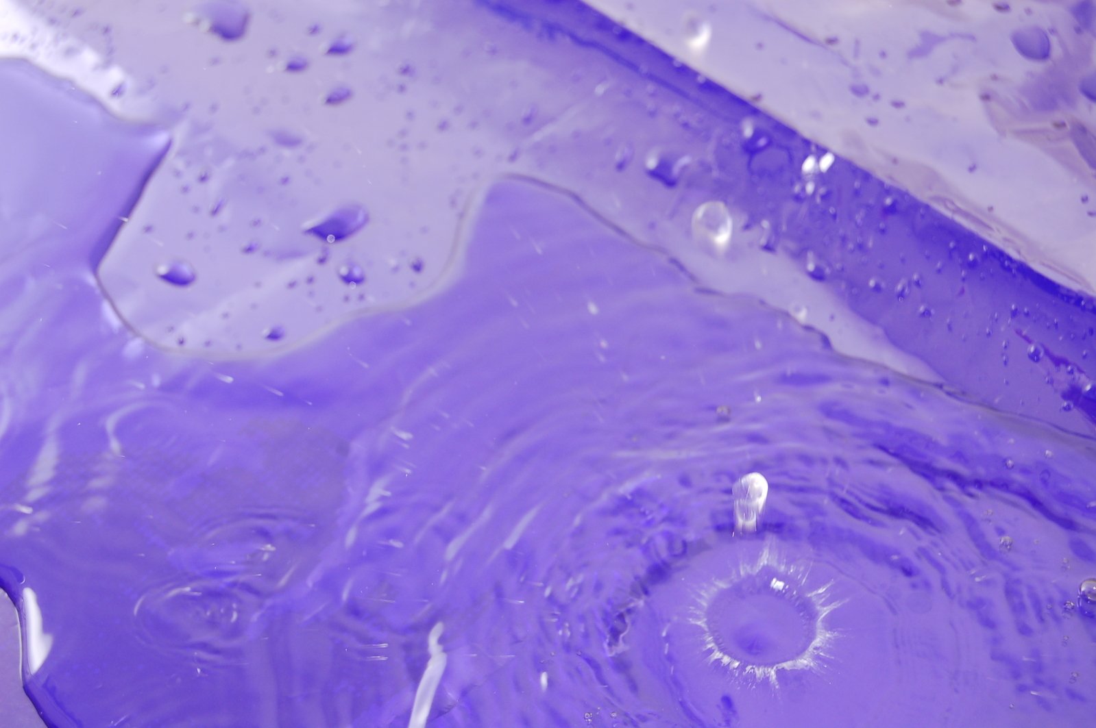 a close - up view of some purple liquid that is leaking on it