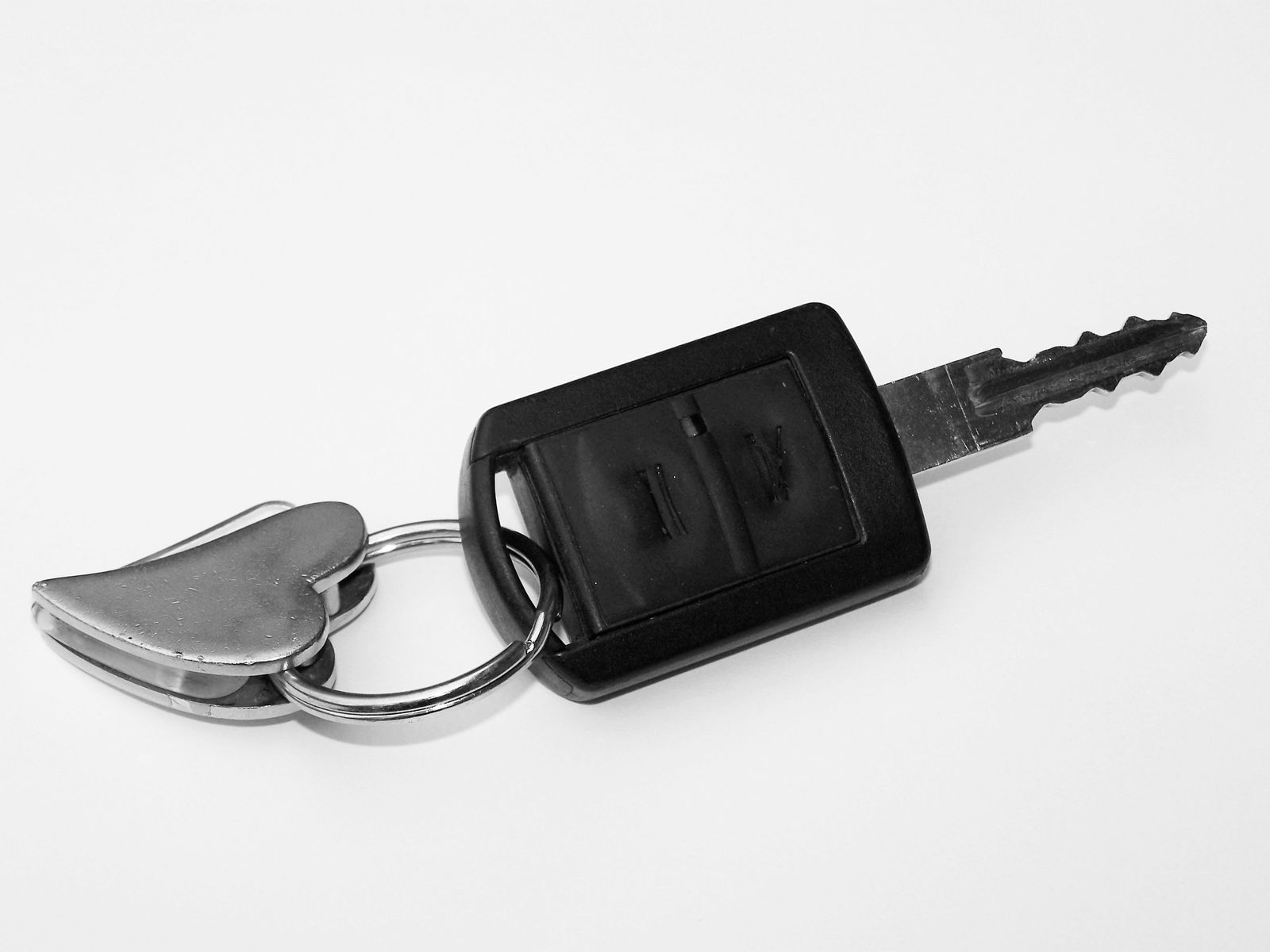 a car keychain with the keys to each key