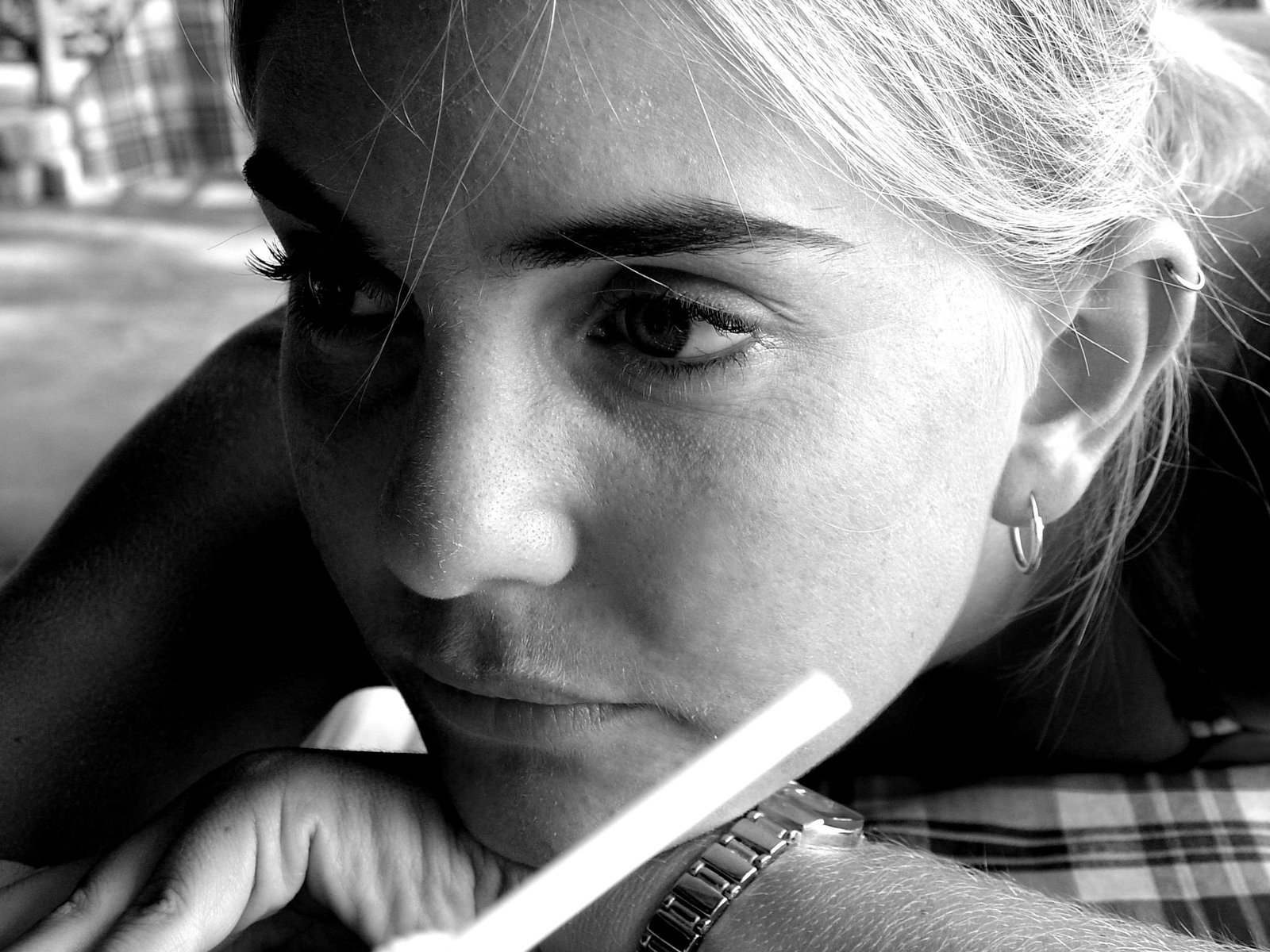 a close up of a person holding a tooth brush