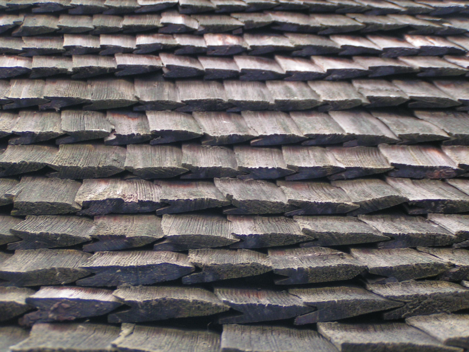 wood shingles and bricks on the roof of a building