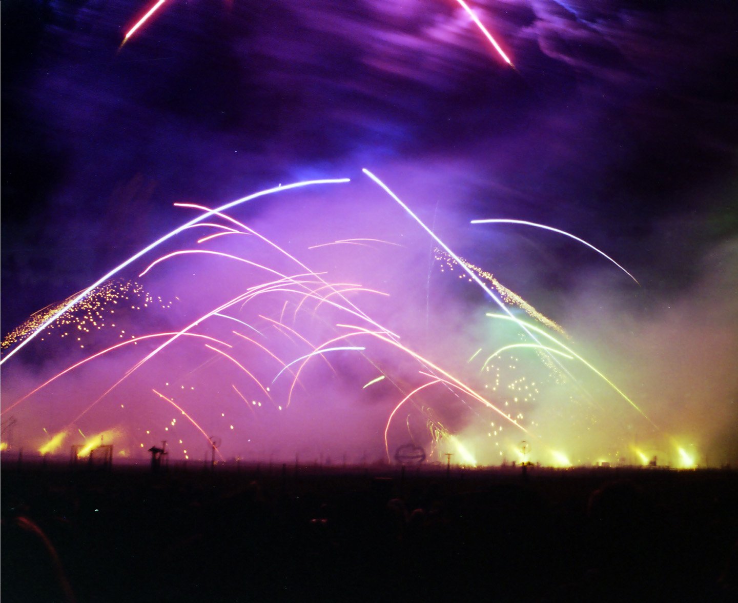 large fireworks exploding off into the sky at night