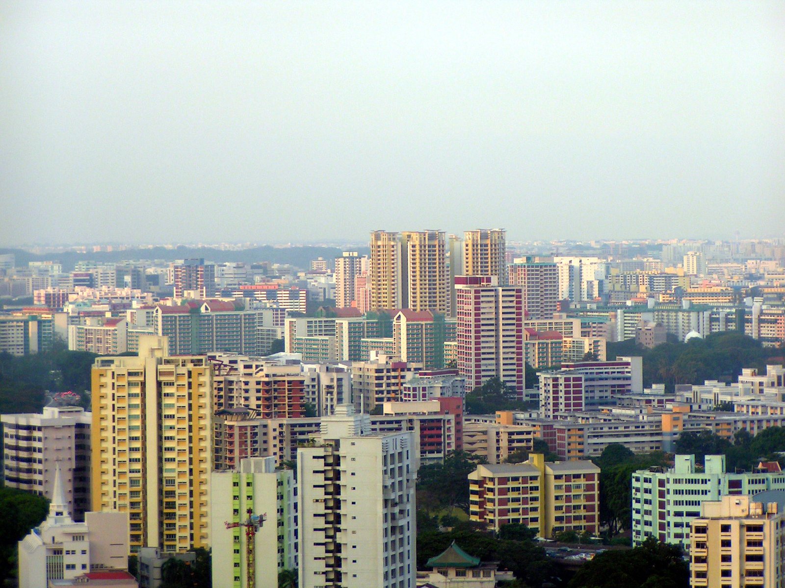 a city with many tall buildings and many trees