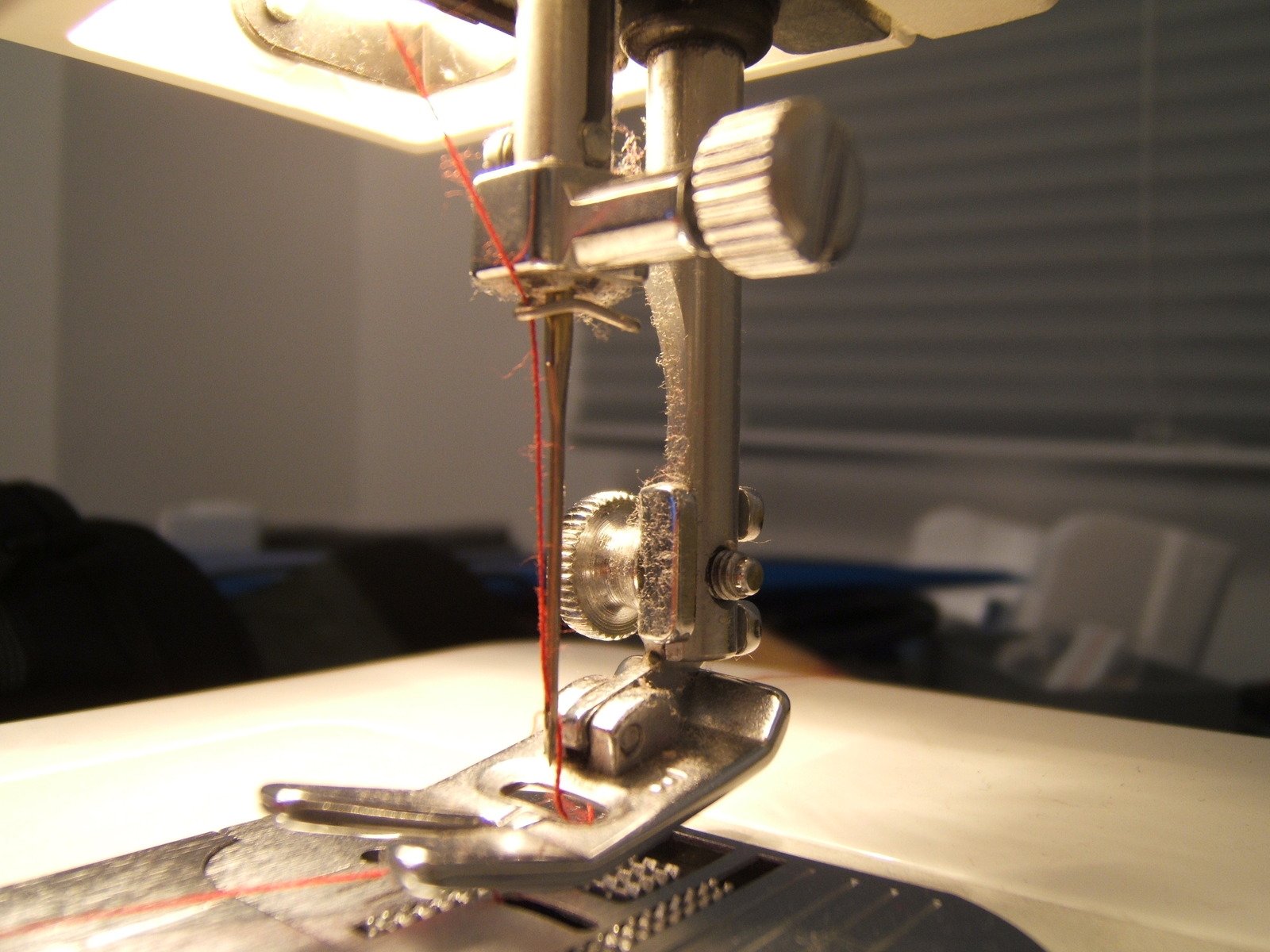 the sewing machine is very close to the white surface