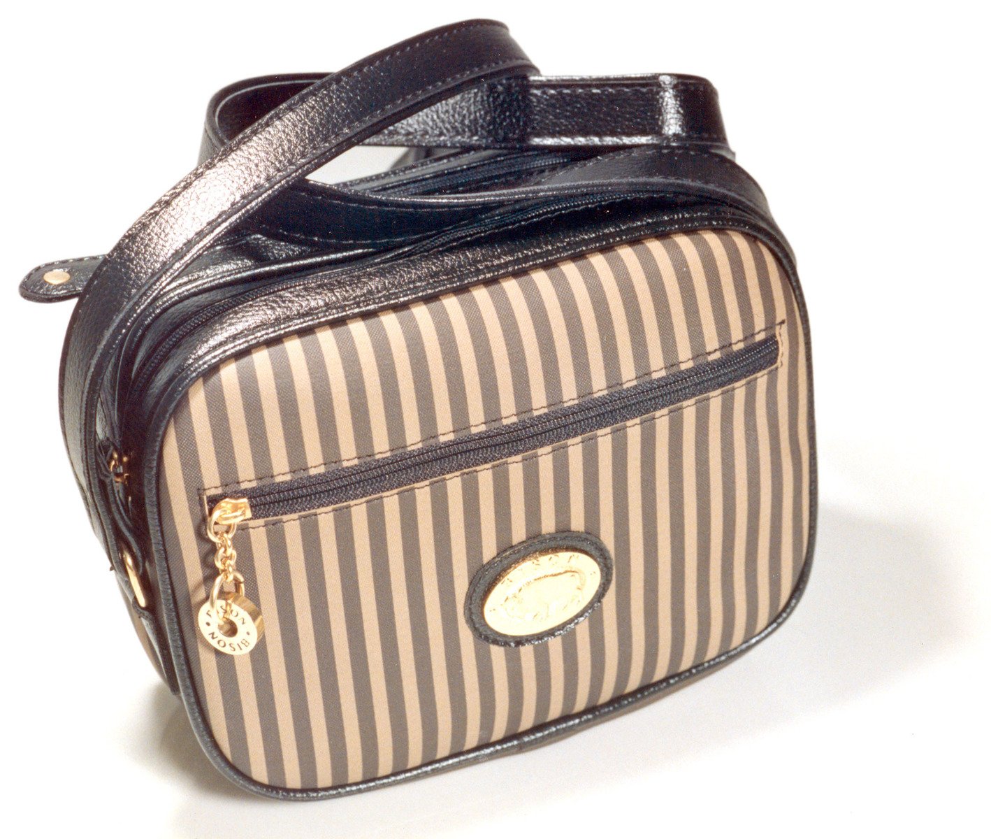 a small, striped brown and black handbag with a tan stripe lining