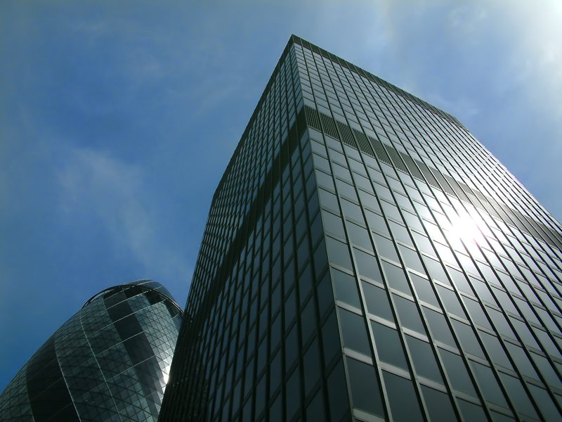 a tall building with some sky in the background