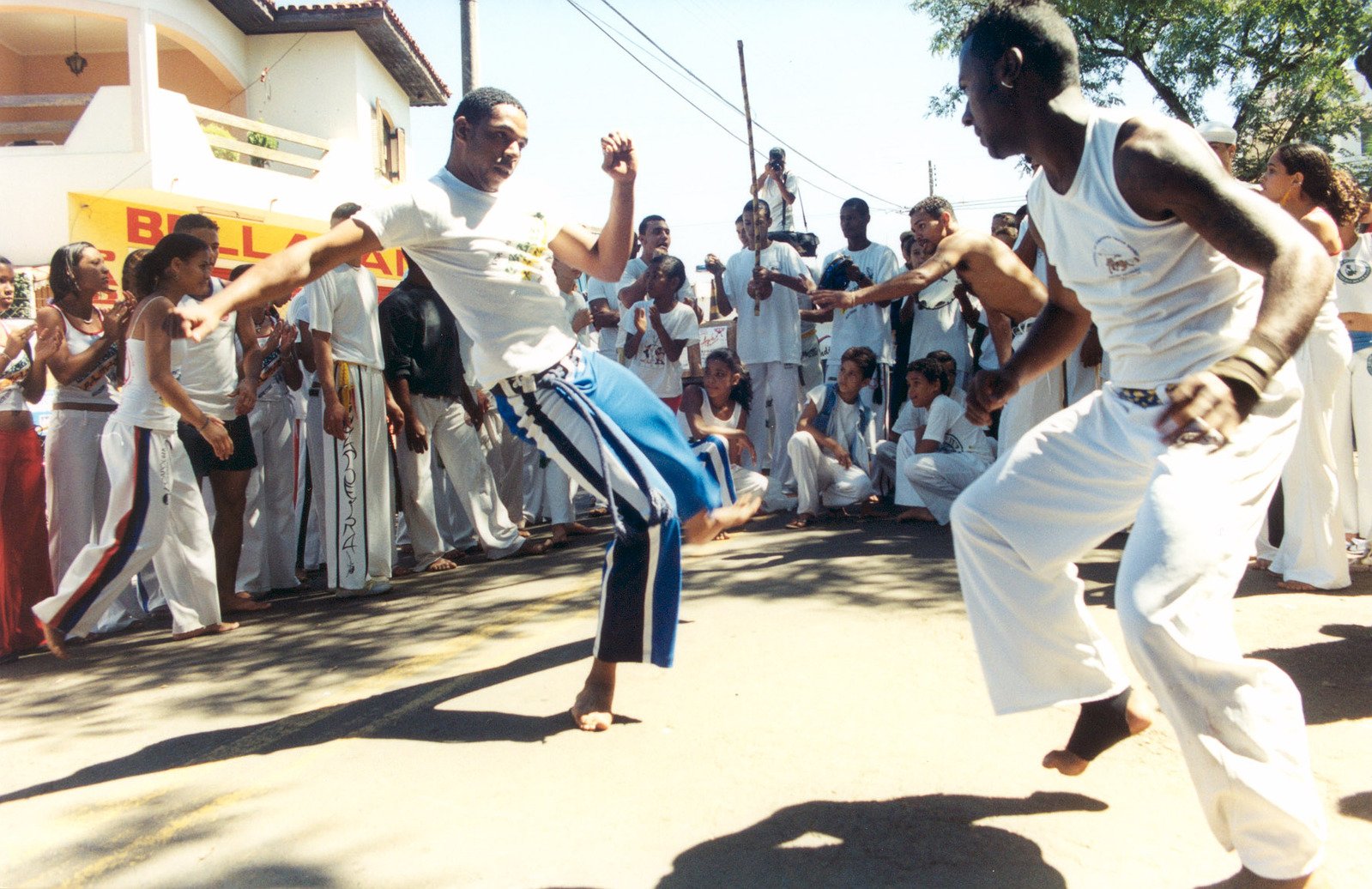 two young men perform a street dance during a festival