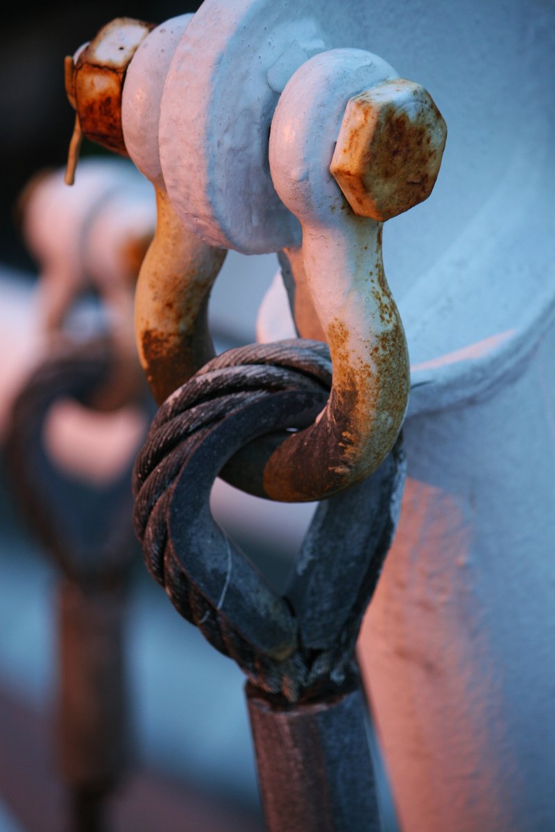 a chain is being used to hold up the metal