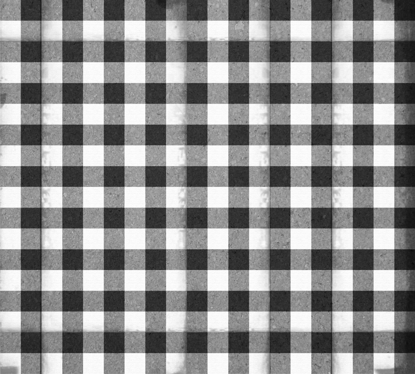 a black and white picture of a checkered curtain